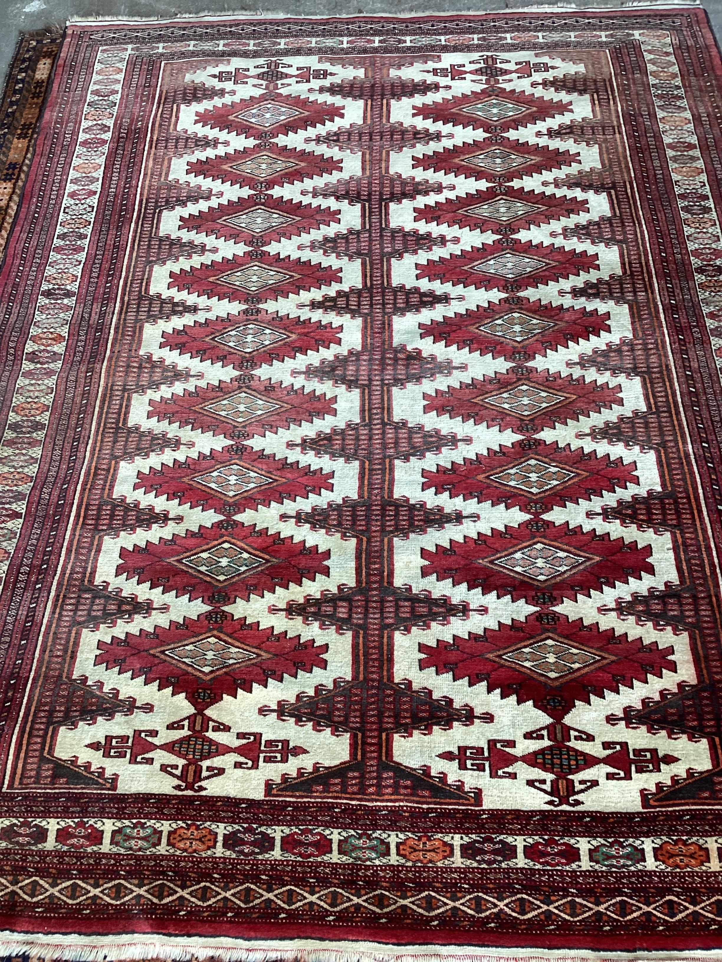 A Bokhara ivory ground rug, 217 x 168cm